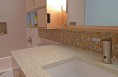 Ice Stone counters with a Hansgrohe  automatic faucet.