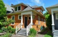 The side dormer blends seamlessly into this lovely Queen Anne home.